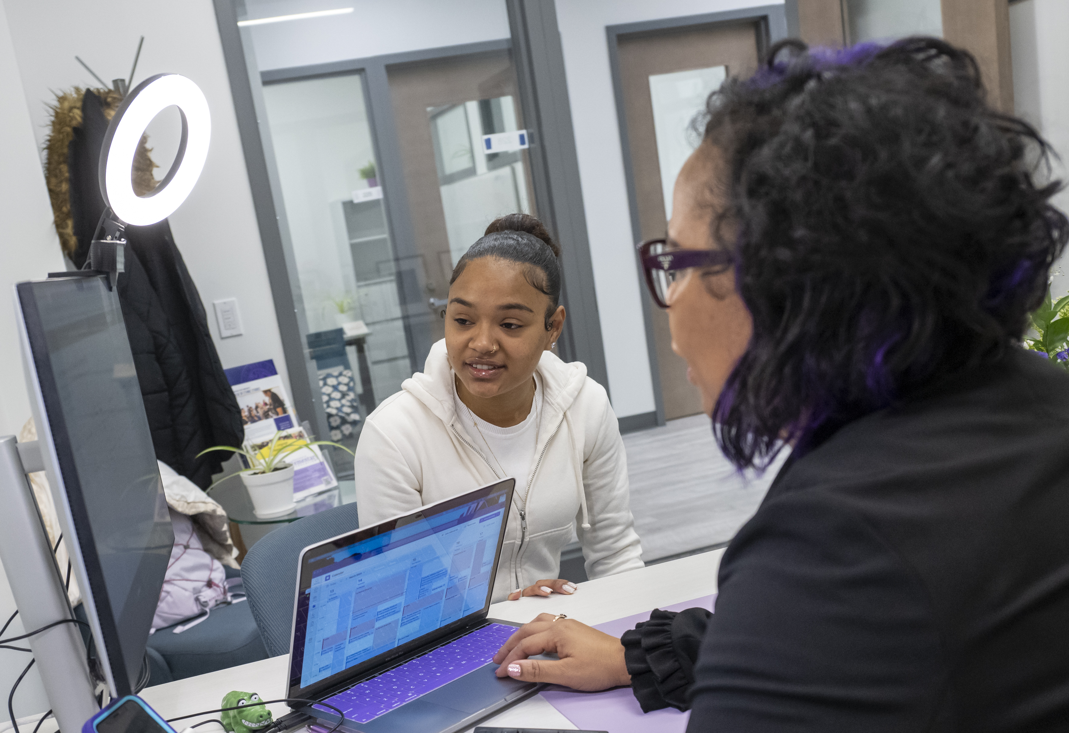 Academic Resources - student with advisor in front of laptop and monitor