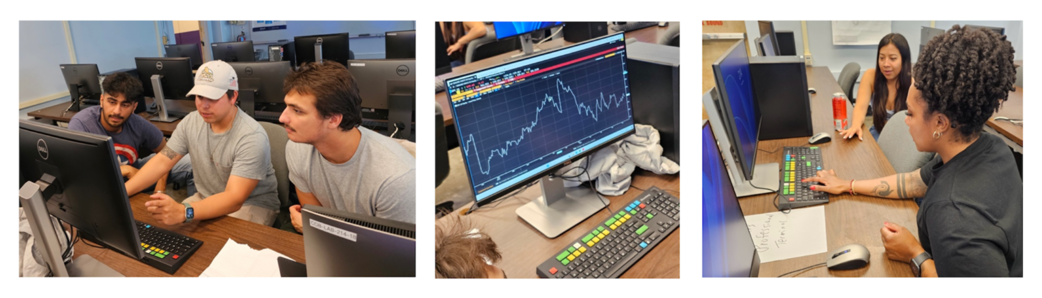 Students typing on Bloomberg Terminals on desks