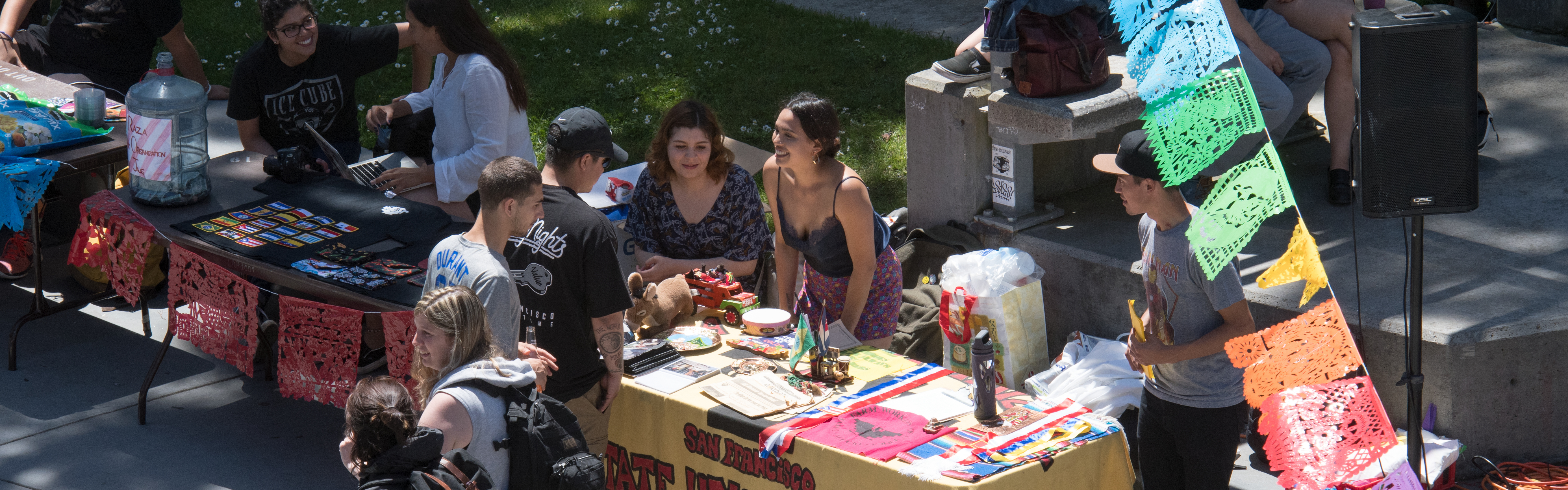 students outside at tabling events