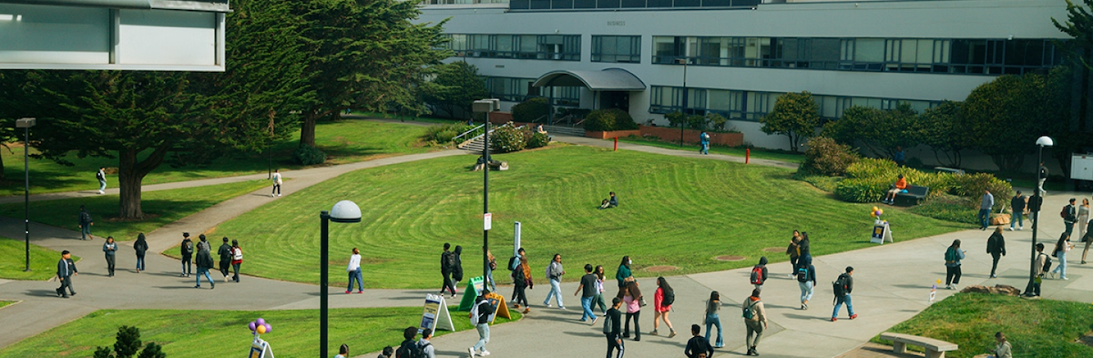 SFSU campus with Business Building in background and students walking around