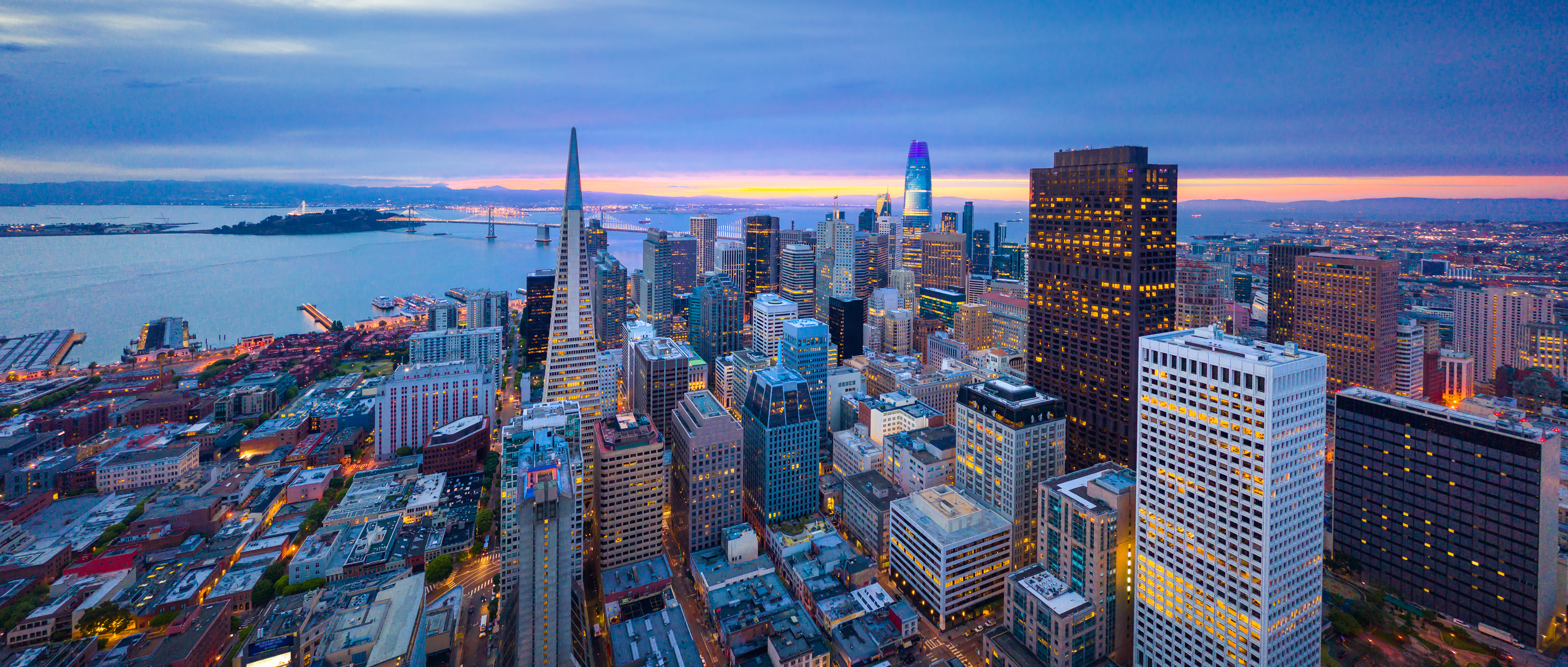 San Francisco downtown at night with glowing building windows