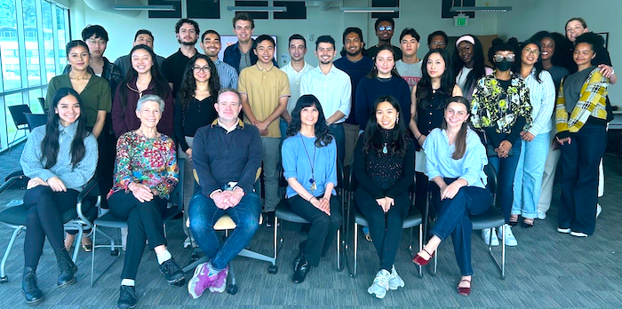 LFCoB Commercial Real Estate Fellows Program students and administrators posing for group photo in a classroom