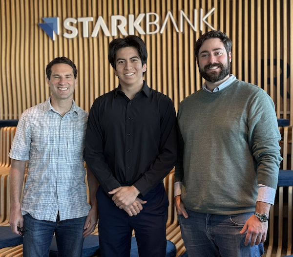 Todd Feldman, Kenneth Estrella, Luiz Mester - three men smiling and standing in a bank lobby
