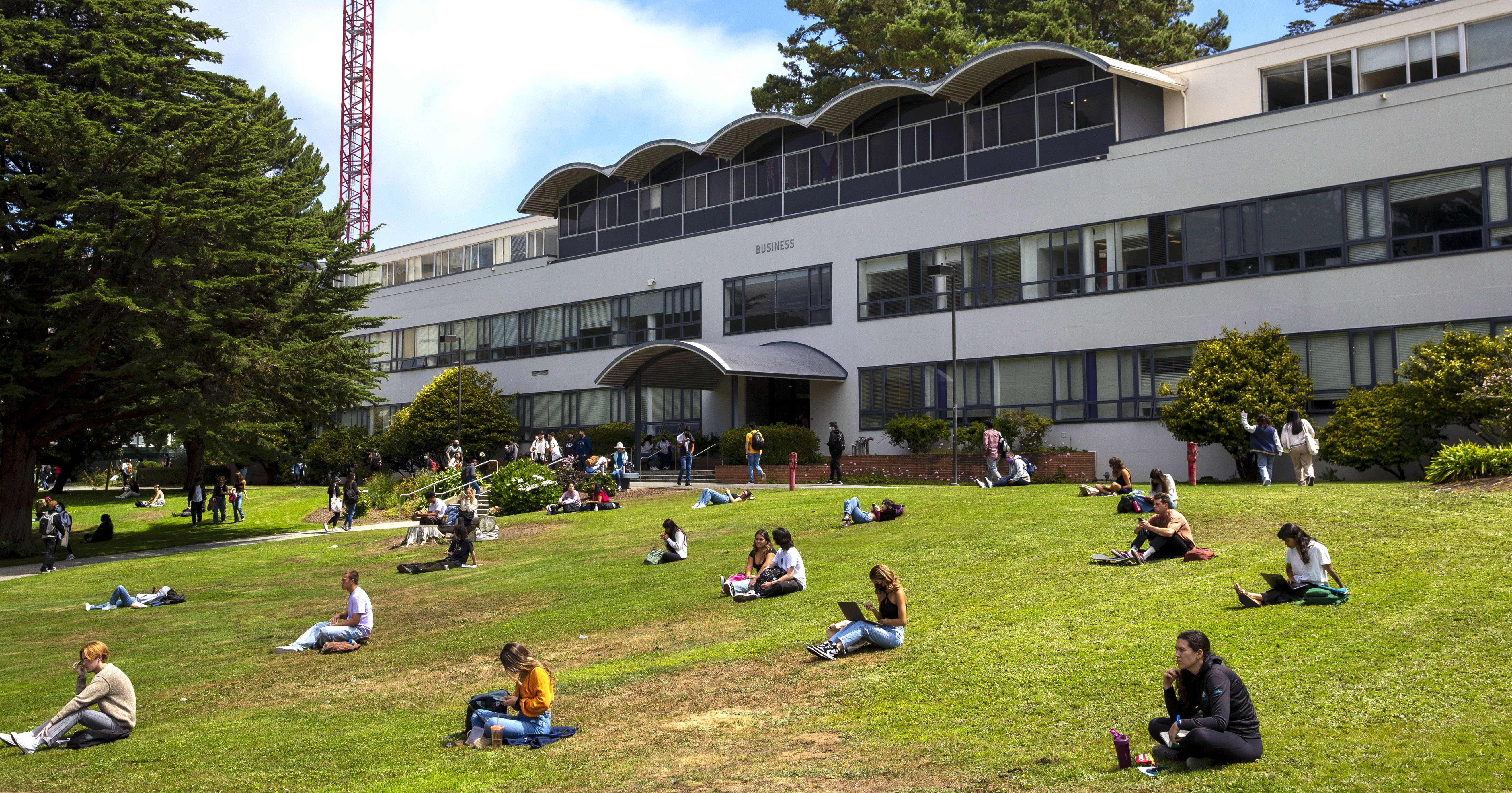 Business Building with students on lawn