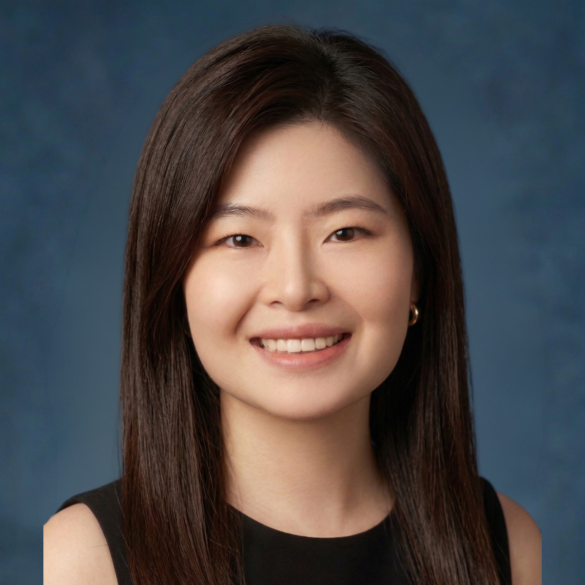 Jianan Shen, MS in Business Analytics student, headshot of smiling woman with long dark hair, wearing a black sleeveless dress