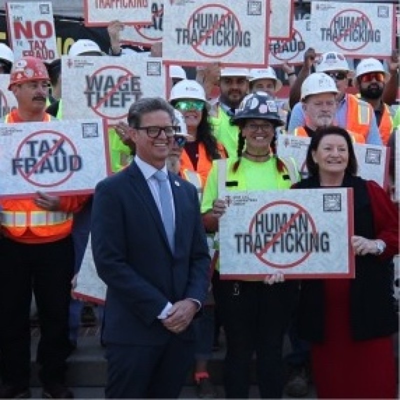Matthew Miller in front of a crowd of union members