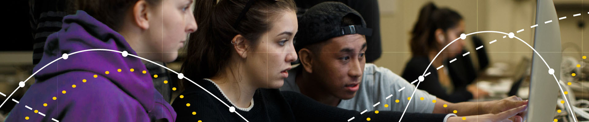 Students looking at computer