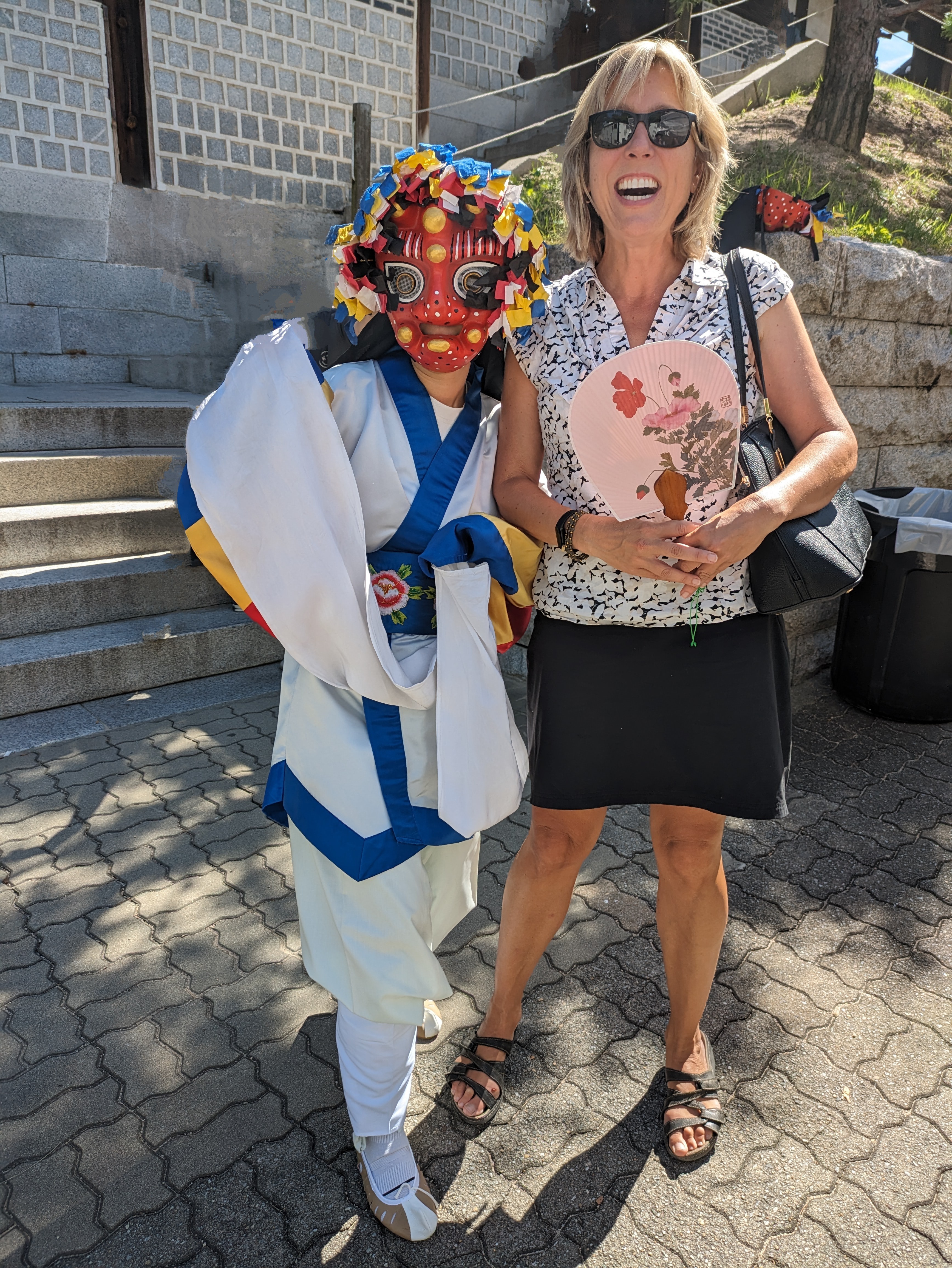 Professor Susan Chollete standing with a woman in a carnaval attire