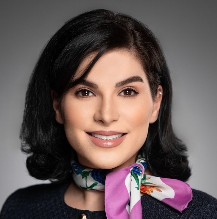 Tanya Aghazadeh, SFSU graduate student in MS in Business Analytics program. Woman with shoulder-length dark hair, wearing floral scarf and dark top