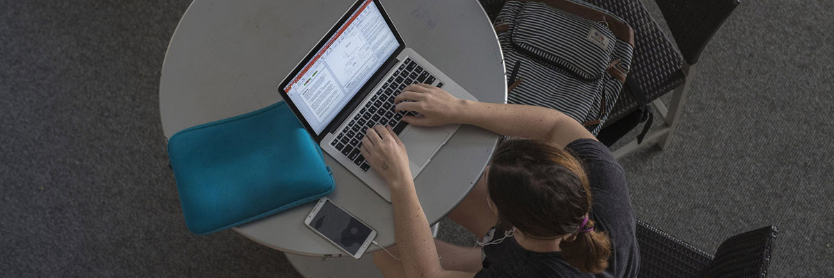 Student working on their personal computer.