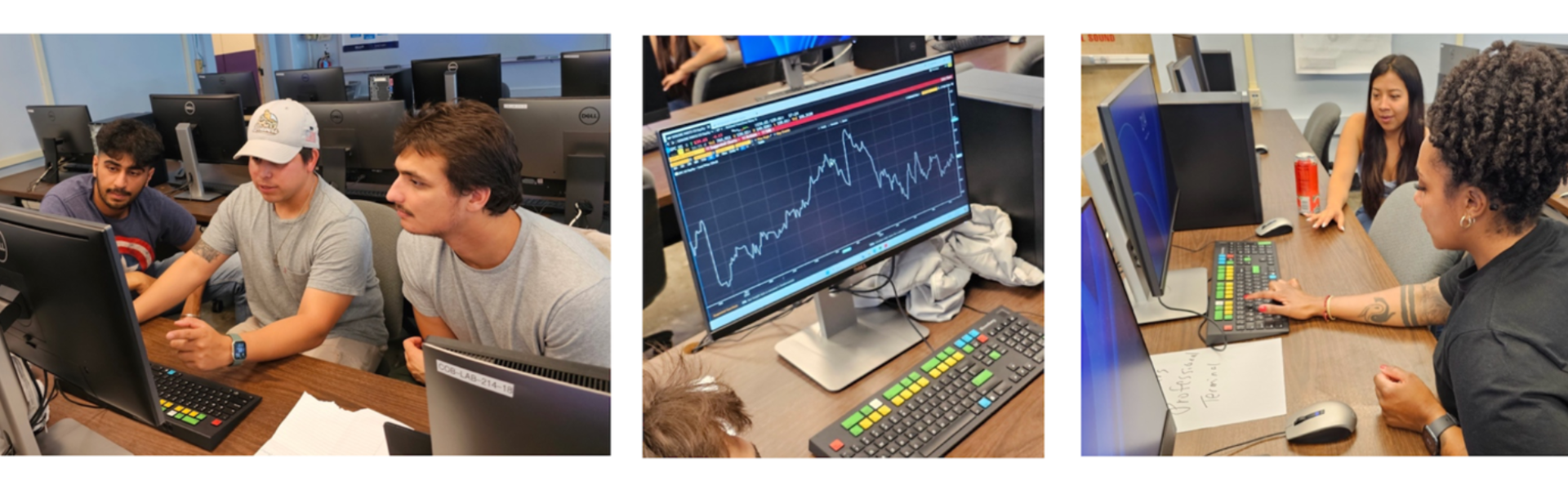 Students typing on Bloomberg Terminals on desks