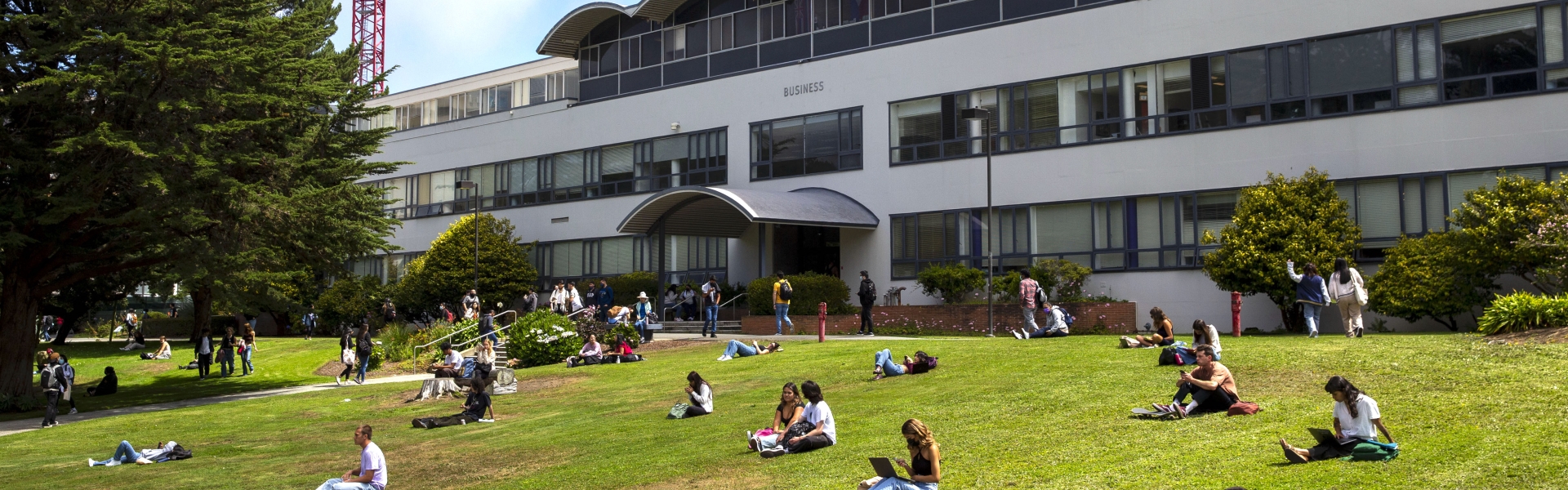 Business Building with students on lawn